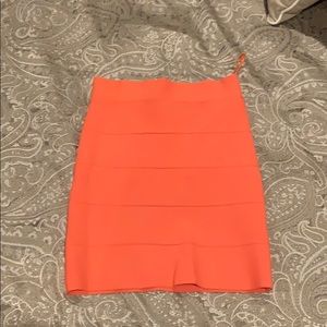 BCBG body con mini skirt ( orangey salmon color)